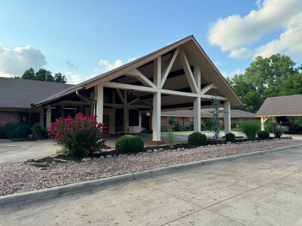 Renovated planting beds beside the covered entrance at Christian Villa